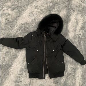 I am selling a kids black Moose Knuckle Winter Coat.